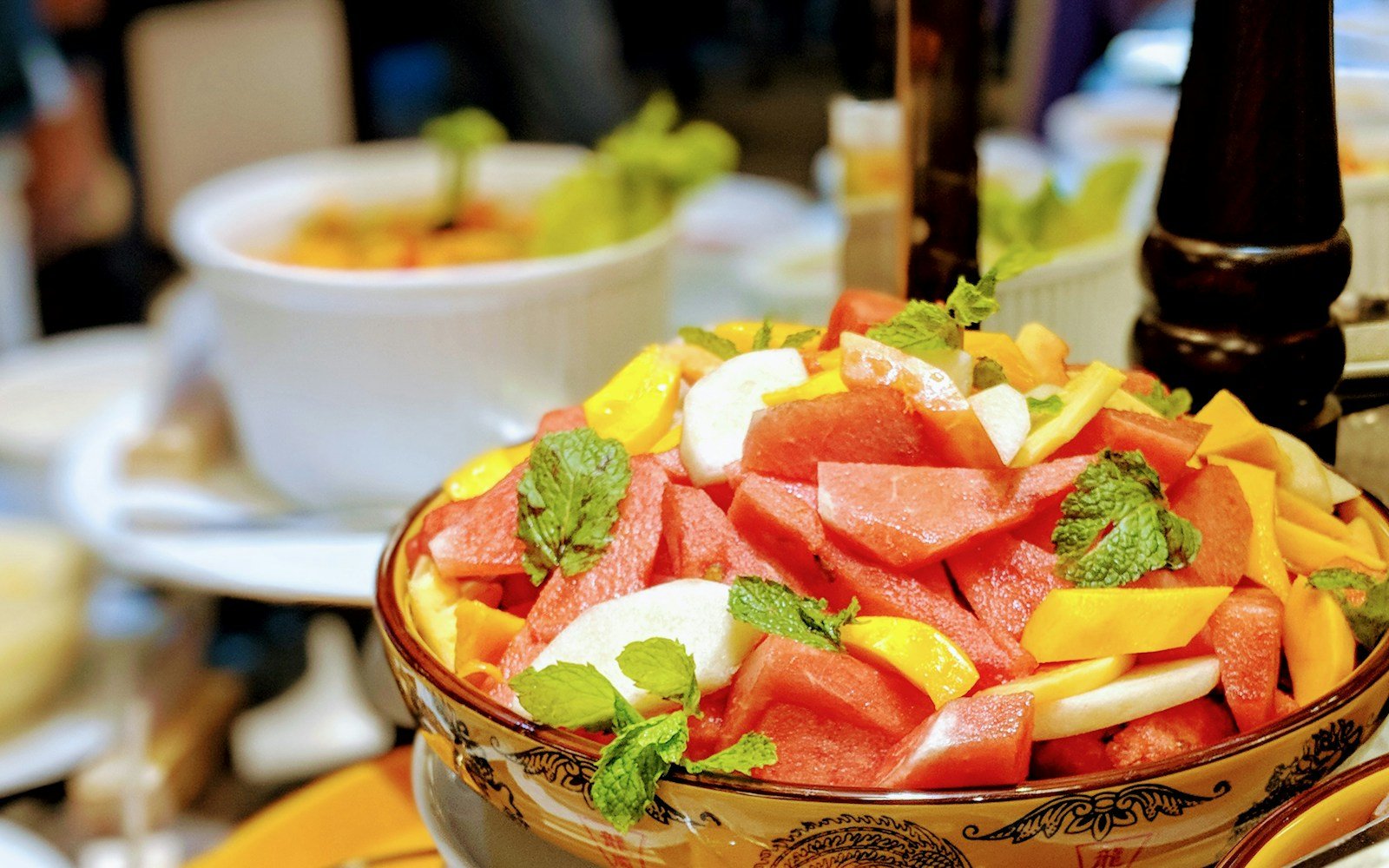 sliced fruits in brown ceramic bowl